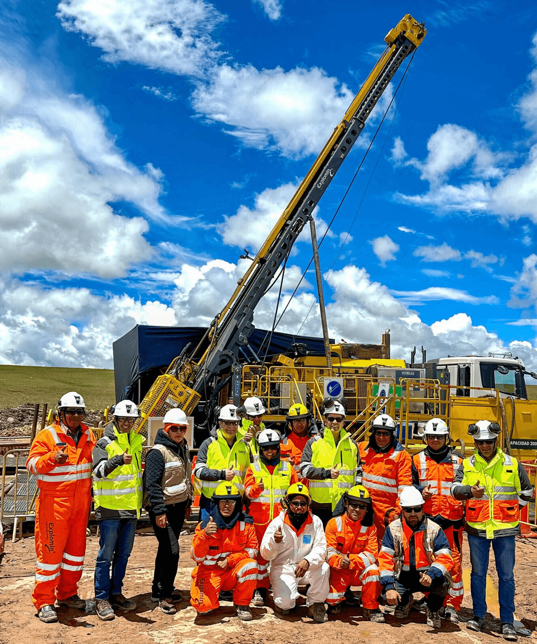 Exploration team and drilling rig at a work site