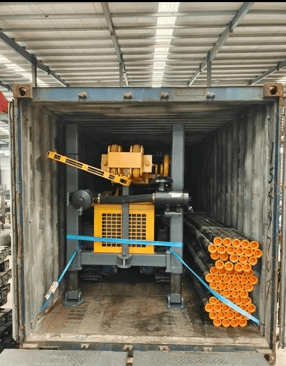 Drilling rig and drill rods secured with straps inside a container